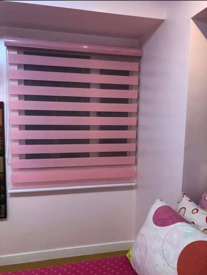 Pink day & night blind fitted in a child's bedroom