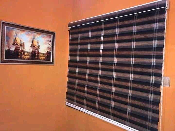 Brown and cream day & night blind fitted in a sitting room